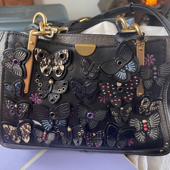 Coach Butterfly Discontinued Style. Used a handful of times. Good condition - Picture 2 of 8